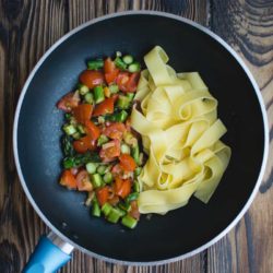 Pasta tagliatelle with asparagus and tomatoes
